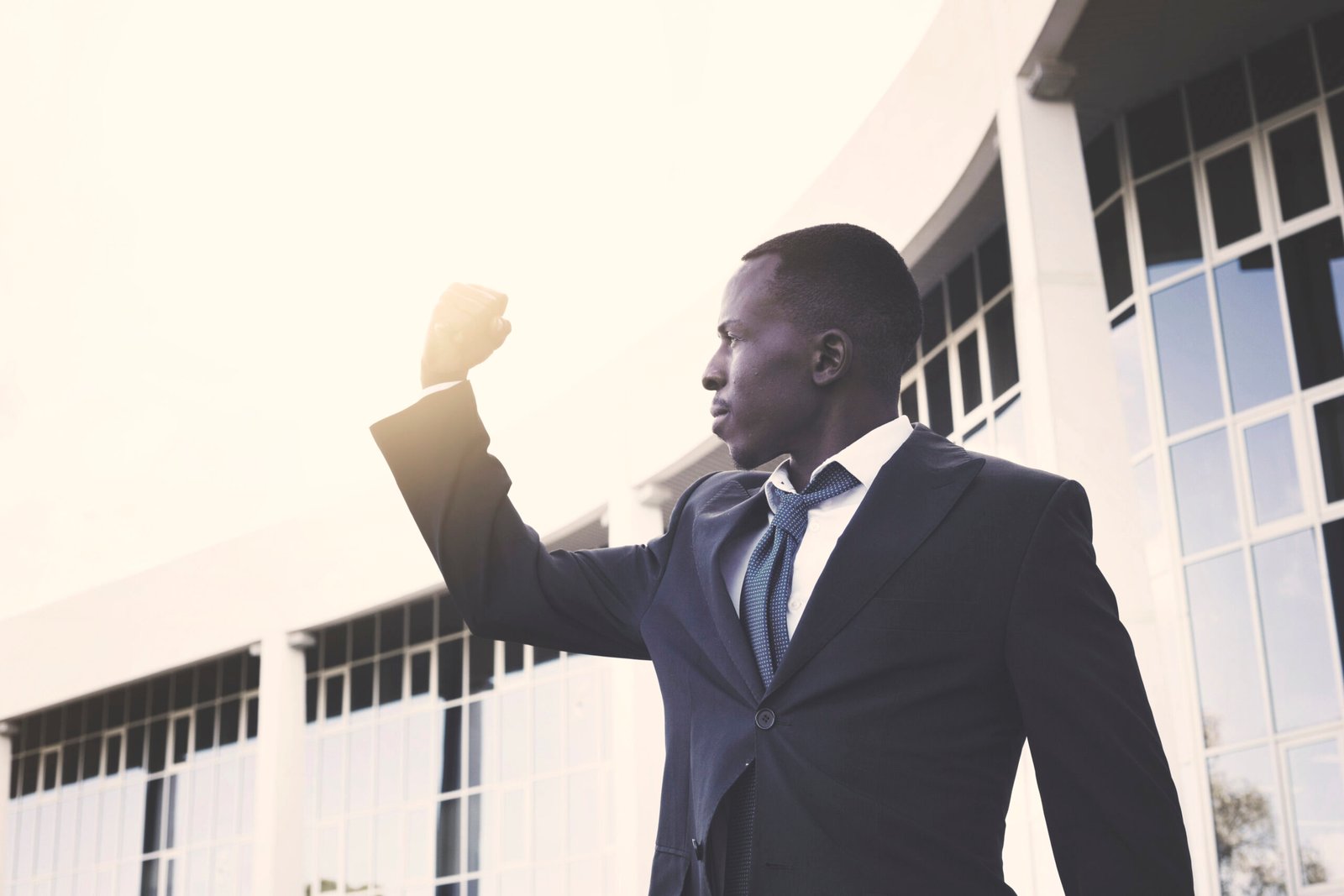 A charismatic leader inspiring a diverse team through a motivational speech, symbolizing leadership, vision, and business growth.